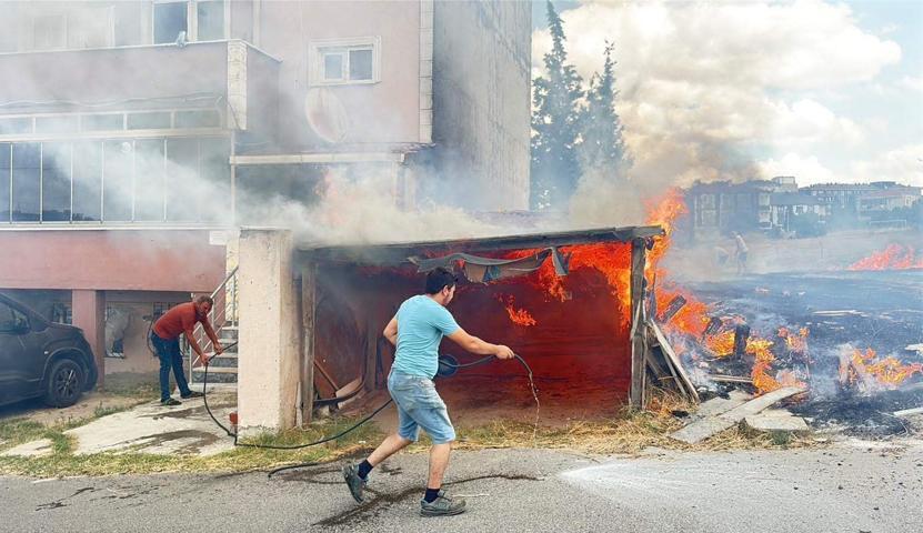 Alevler binanın garajını sardı, kardeşini kucağına alıp dışarı kaçtı