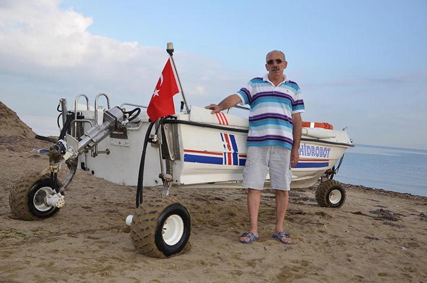 Hidrolik ustasından karada ve denizde gidebilen tekne sistemi