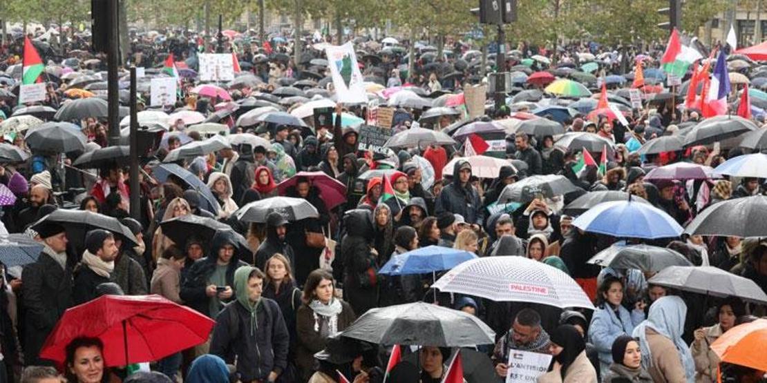 Yağmur altında tek yürek oldular: Fransada Gazze yürüyüşü
