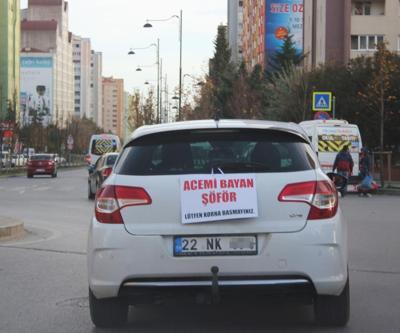 Kadın sürücüden arabasının arkasına ilginç pankart