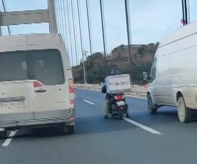 Köprüden geçen motosikletliye lodos kalkanı