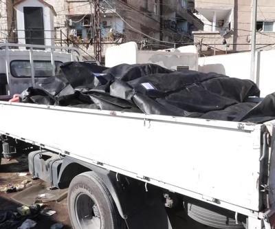 SURİYEDE ESAD KURBANLARI ARANIYOR: Şamda bir depoda 20 ceset bulundu