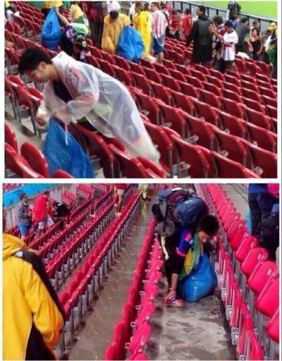 Japon seyirciler stattan ayrılmadan önce çöpleri topladı