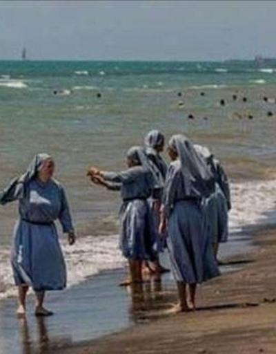 Denize giren rahibelerin fotoğrafını paylaşan imama şok