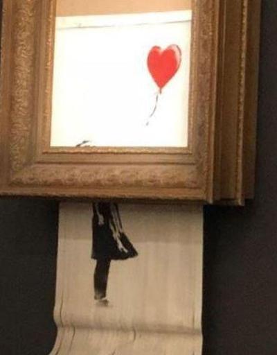 Banksynin Kırmızı Balonlu Kız adlı eseri satıldıktan sonra kendi kendini yok etti
