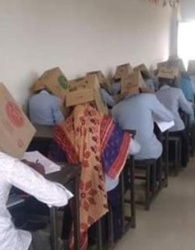 Hindistanda tepki çeken uygulama: Kopya çekmesinler diye öğrencilerin başına koli geçirildi