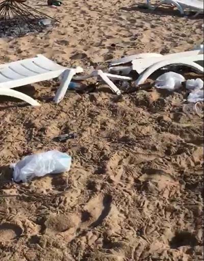 Bozcaada sahilindeki partide şezlongları kırıp şemsiye yaktılar