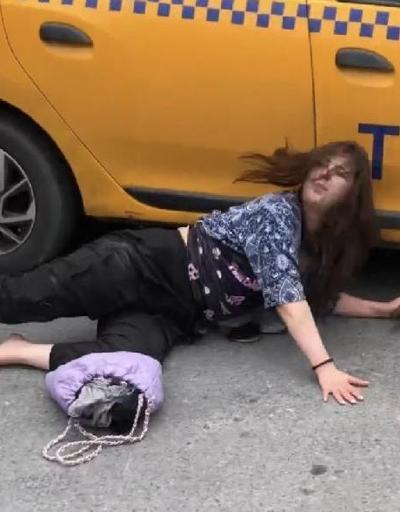 Taksiciye kızdı arabanın altına girdi