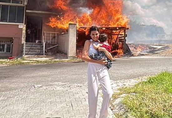 Alevler binanın garajını sardı, kardeşini kucağına alıp dışarı kaçtı