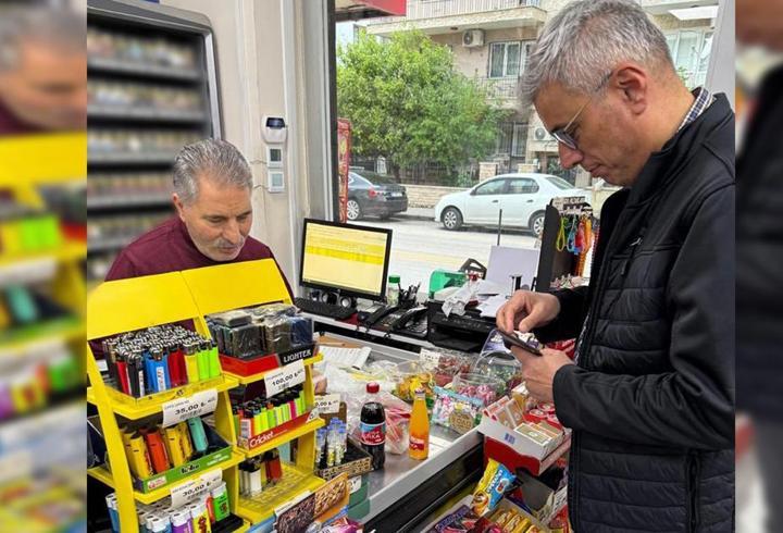 Bakan Memişoğlu'ndan esnafa destek alışverişi
