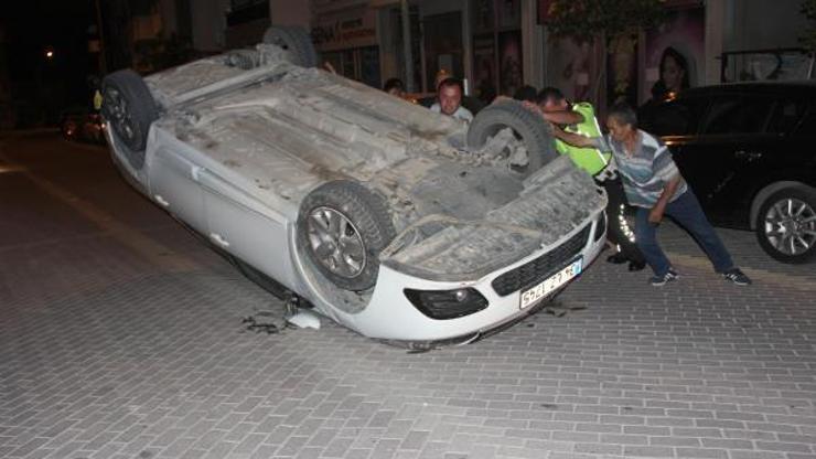 Takla atan otomobilden yara almadan kurtuldu