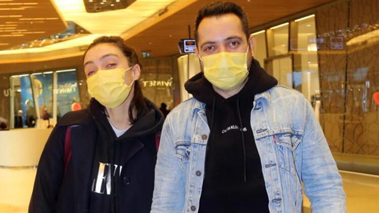 Merve Dizdar ve eşi Gürhan Altundaşar el ele alışverişte