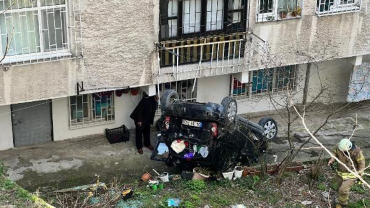 Otomobil bina bahçesine düştü