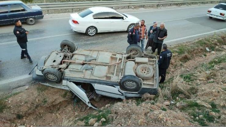 Takla atan otomobilden yara almadan kurtuldu