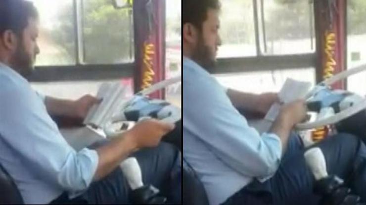 Otobüs kullanırken kitap okuyan sürücü kamerada