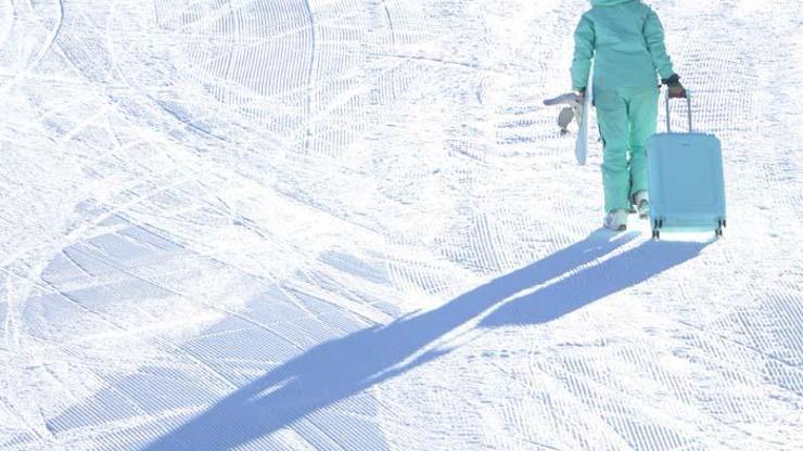 Palandökende bavul ile snowboard şaşırttı