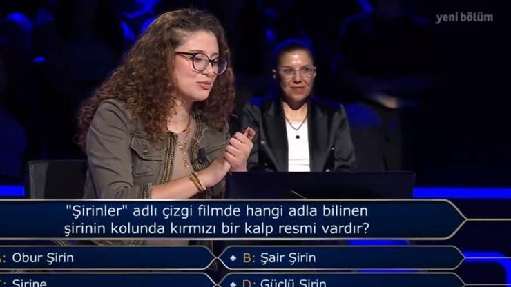 Güçlü Şirin kolunda kırmızı kalp Şirinlerde hangi şirinin kolunda kırmızı bir kalp resmi vardır Kim Milyoner Olmak İster Şirinler sorusu