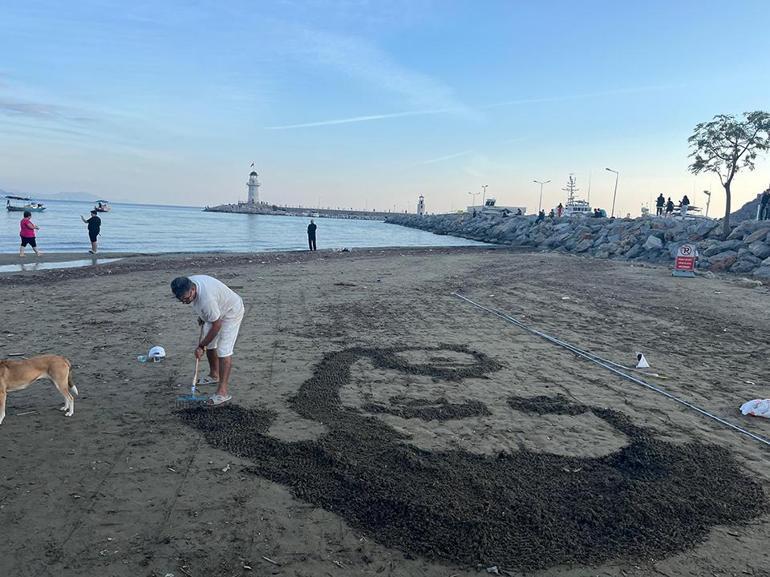 İranlı sanatçı sahile Barış Mançoyu çizdi