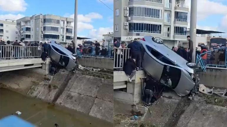 Kaza yapan otomobil köprüde asılı kaldı
