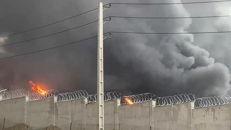 Son dakika... İranda zehirli yağmur tehlikesi: Türkiyeyi etkiler mi CNN TÜRK vurulan petrol deposuna girdi